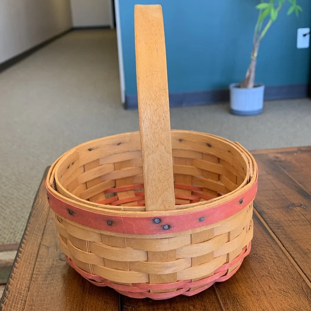 Longaberger Basket with Red Accent Weave. Single stationary handle.